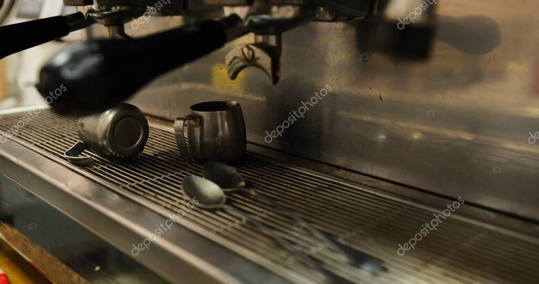 Cleaning tools next to an espresso machine