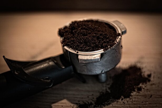 Cafe owner comparing different espresso machines