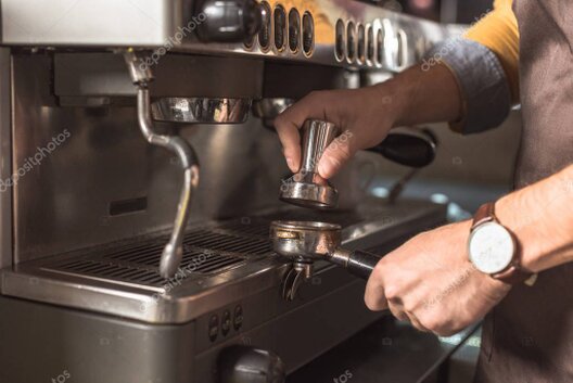 Technician servicing a commercial coffee machine