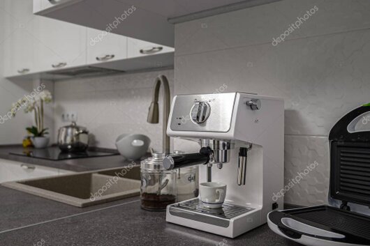 Row of espresso machines displayed on a counter