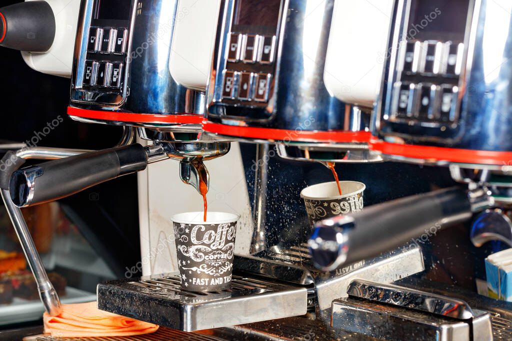 Row of commercial espresso machines in a showroom
