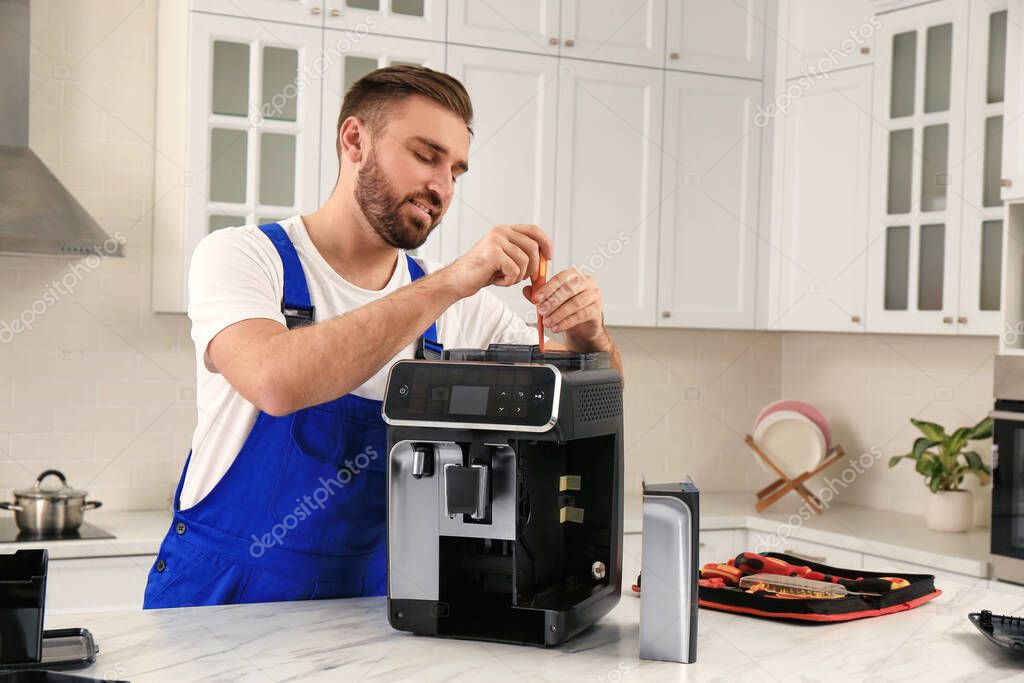 Technician repairing a commercial coffee machine