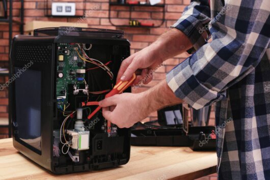 Coffee machine technician working on a professional espresso machine
