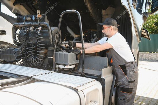 Technician inspecting a commercial coffee machine