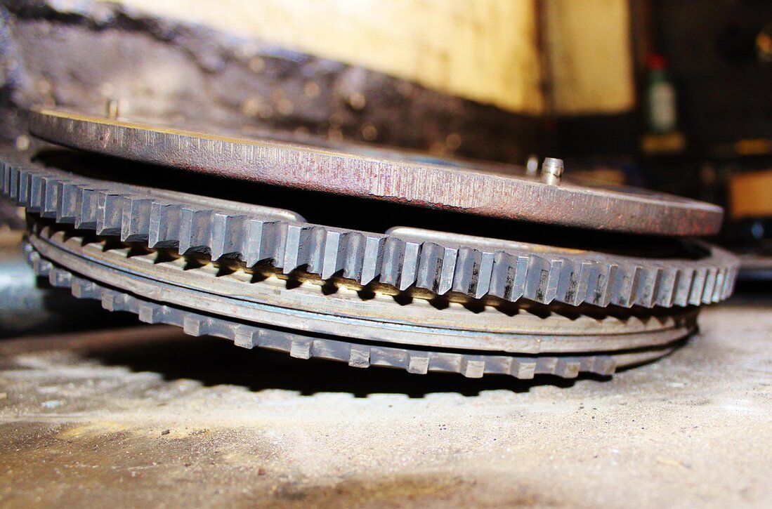 Collection of espresso machine spare parts on a workbench
